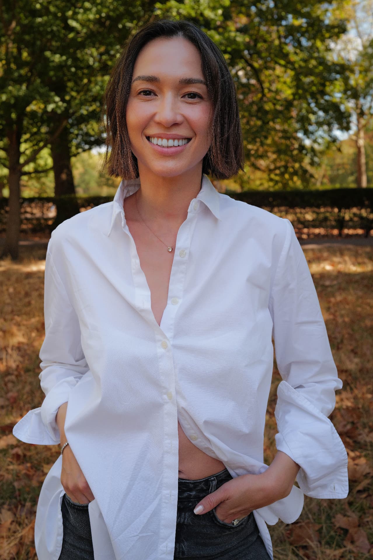 Portrait of Liv Golding smiling in a white shirt